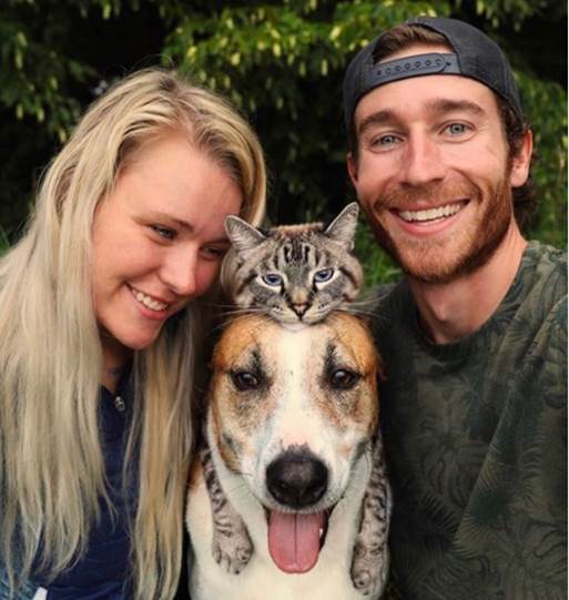 dog and cat siblings with parents